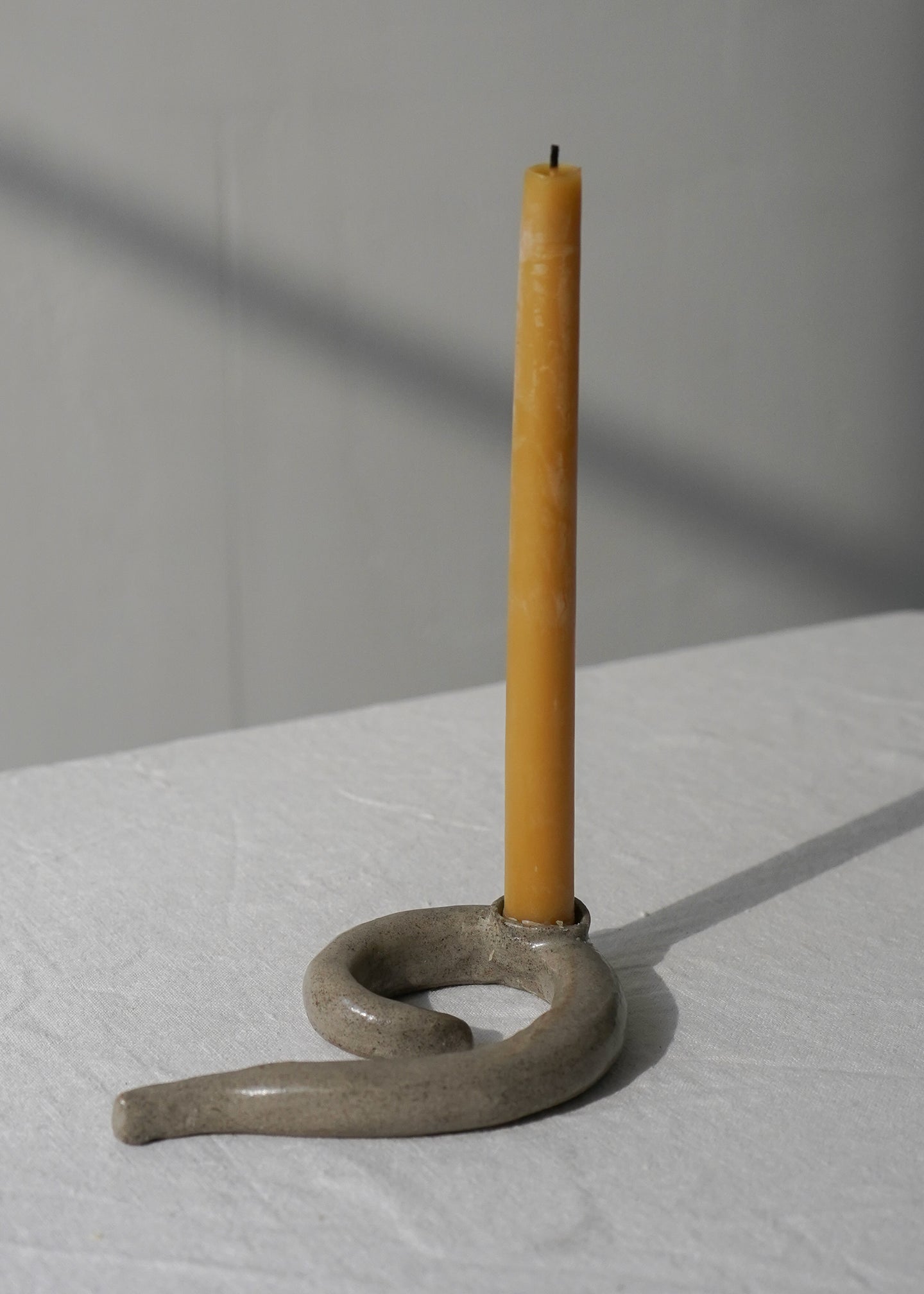 Small grey candle holder with candle